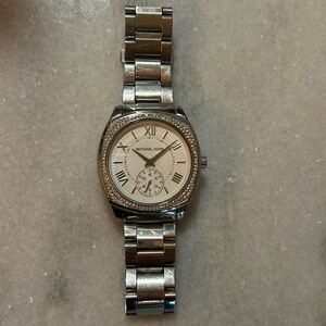 Stainless steel woman’s Michael Kors watch just needs battery